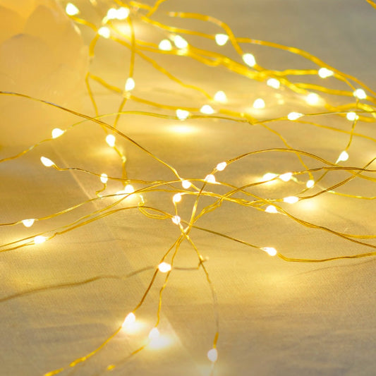 String of small lights on a yellow background