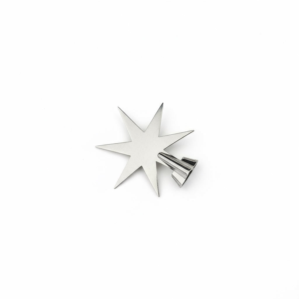 Gold star-shaped object on a white background