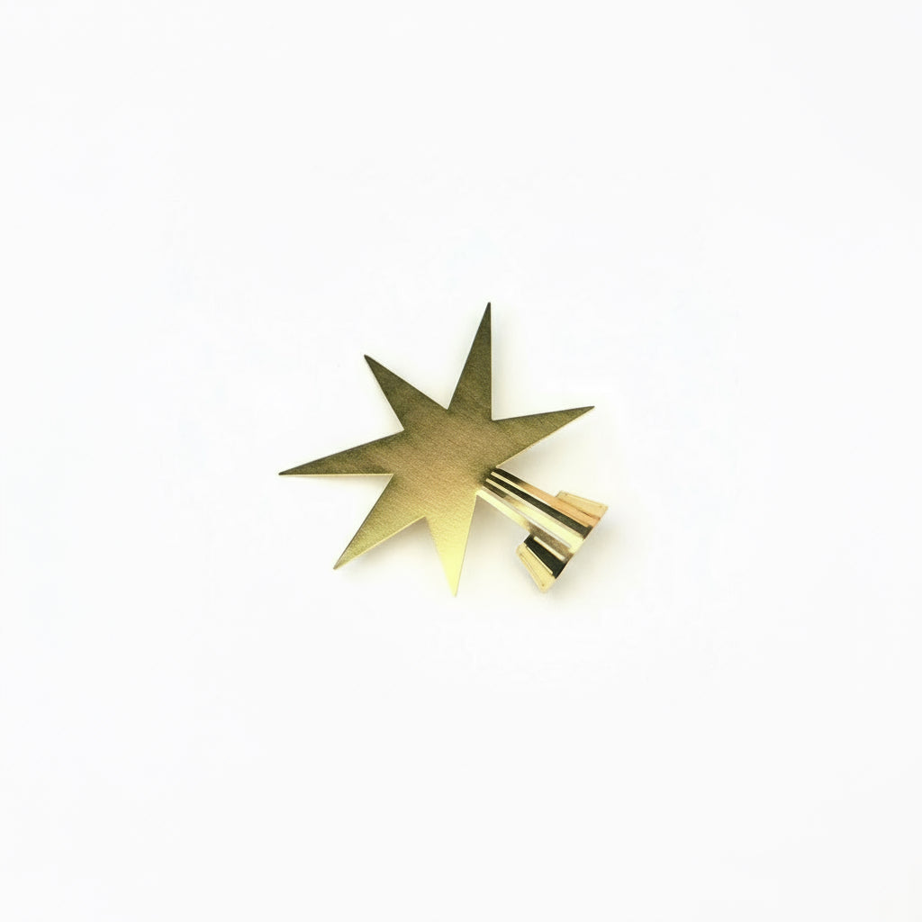 Gold star-shaped object on a white background
