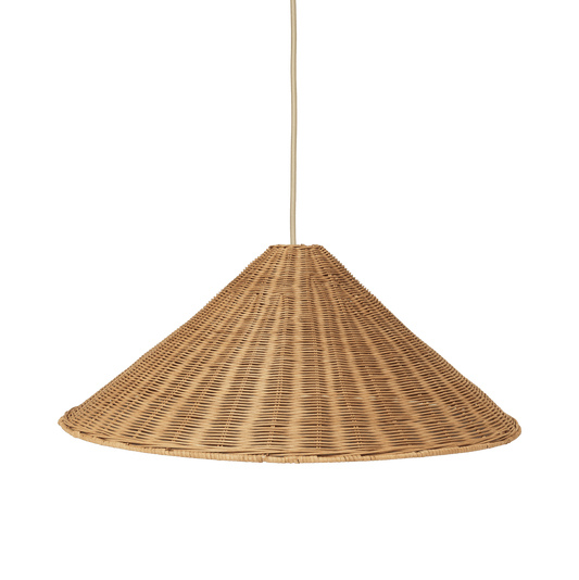 Woven rattan pendant light on a green background