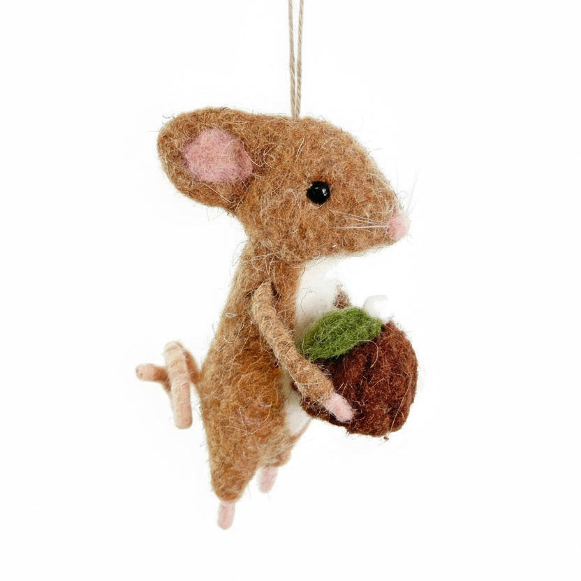 Felt mouse ornament holding an acorn on a white background