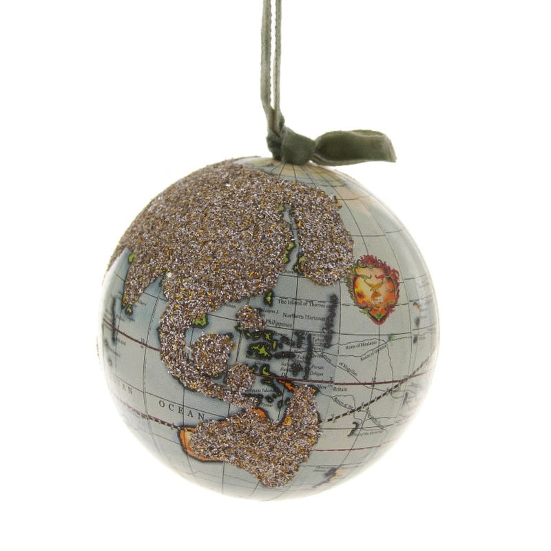 Decorative ornament shaped like a globe with map design on a white background