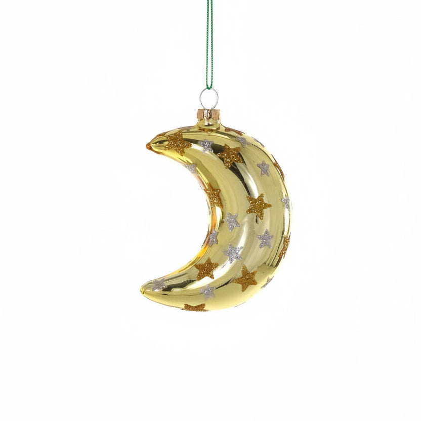 Gold crescent moon ornament with star designs on a white background