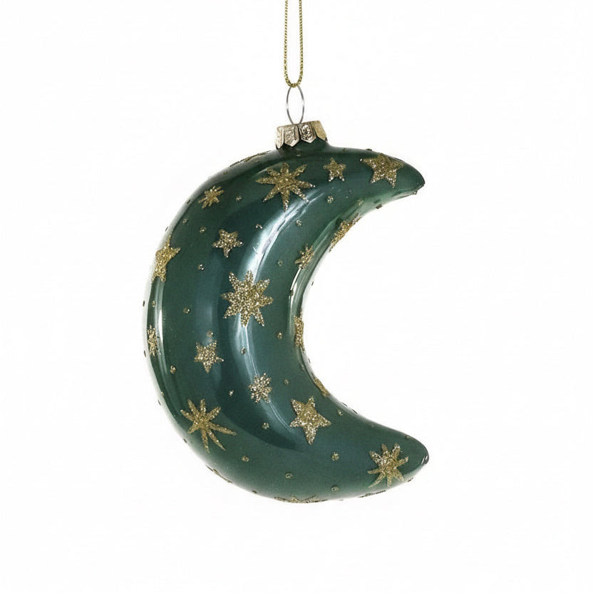 Green crescent moon ornament with gold stars on a white background