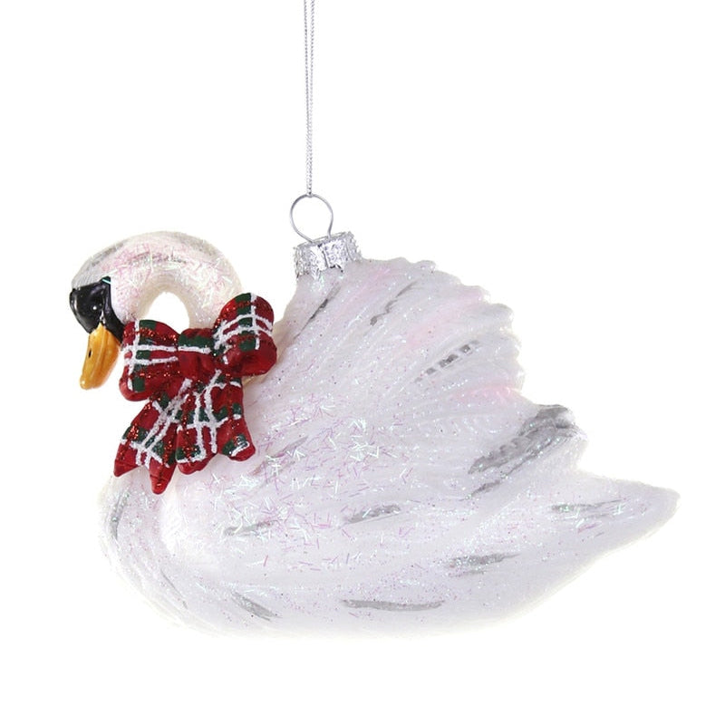 Decorative swan ornament with a red bow on a white background