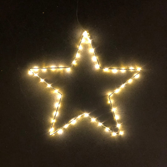 Star-shaped light decoration on a black background
