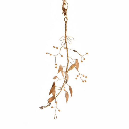 Decorative branch with leaves and beads on a white background