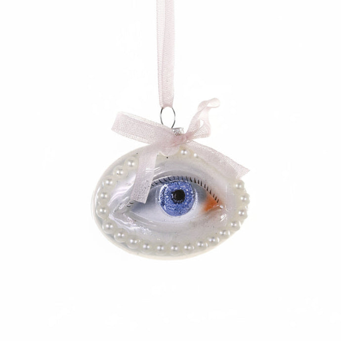 Decorative eye ornament with a white ribbon on a white background
