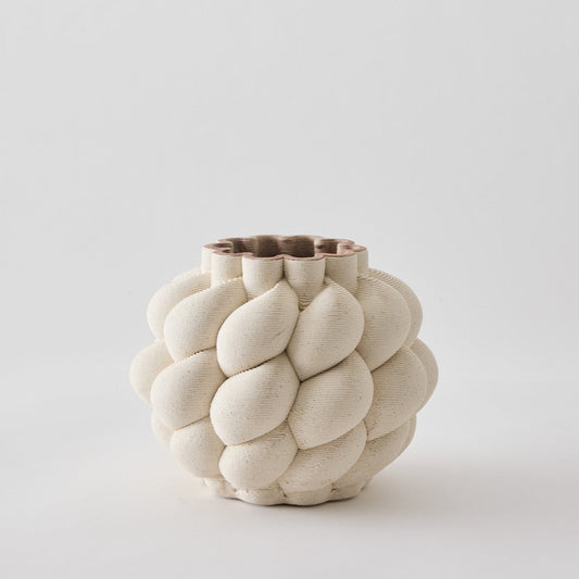 White textured vase on a light gray background