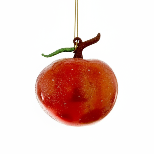 Decorative red fruit ornament with a gold hook on a white background