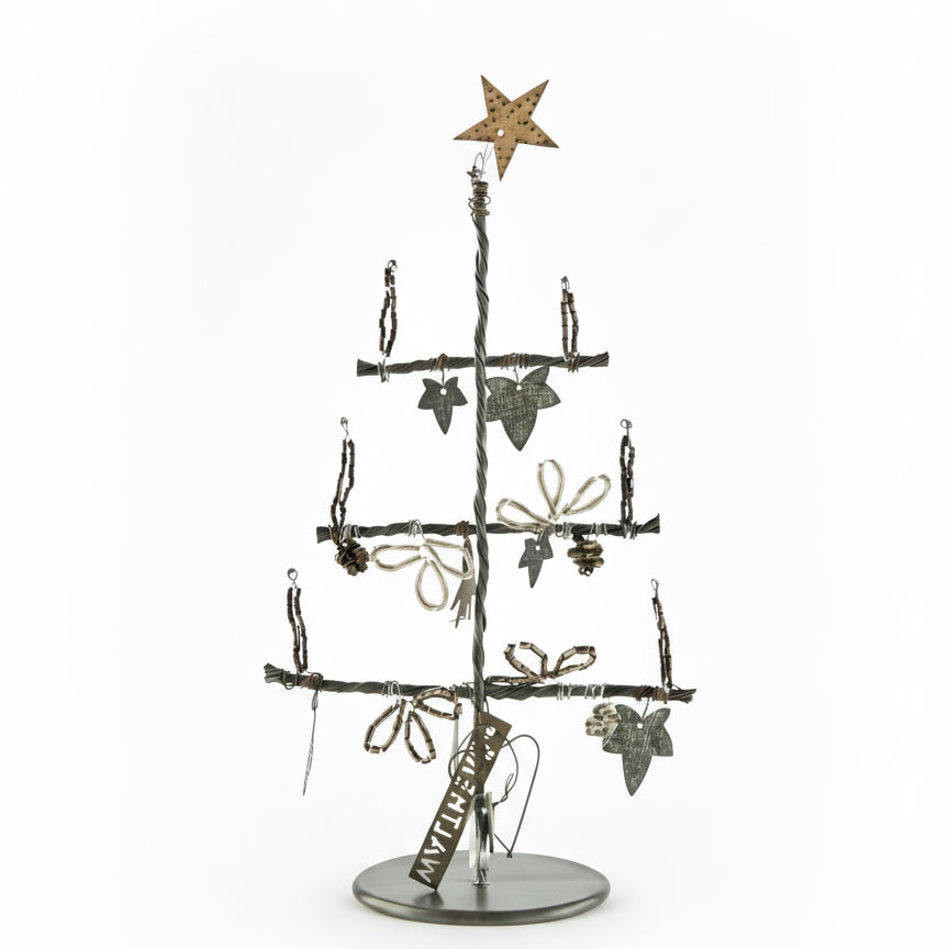 Decorative Christmas tree made of branches with star and leaf ornaments on a white background