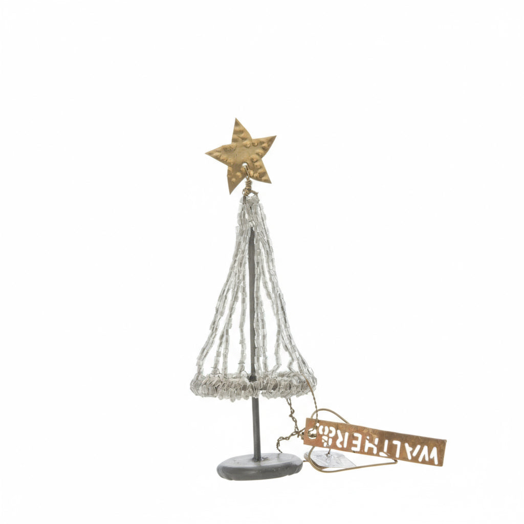 Decorative Christmas tree with star on top and 'Walter Heine' tag on a white background